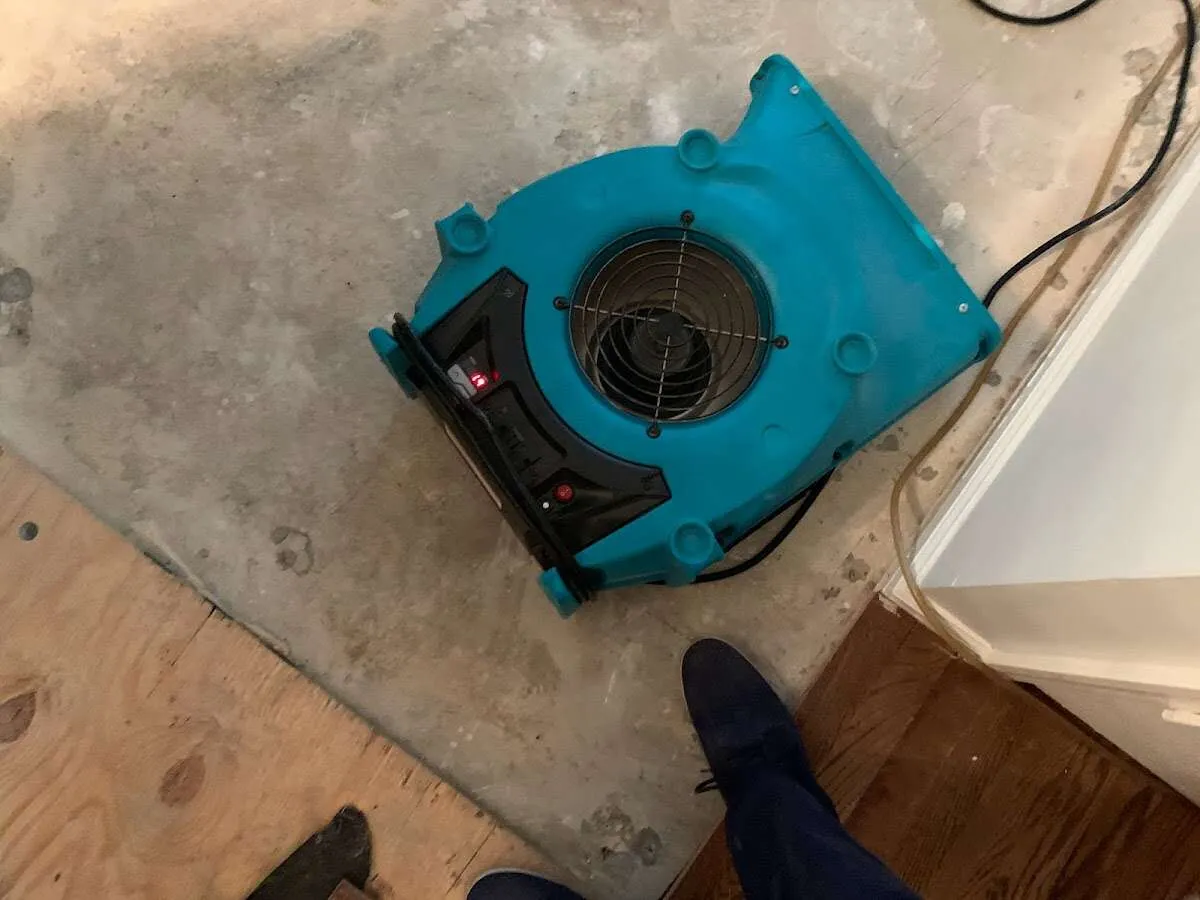 Air mover drying subfloor during Leak Detection & Repair in Spokane Valley